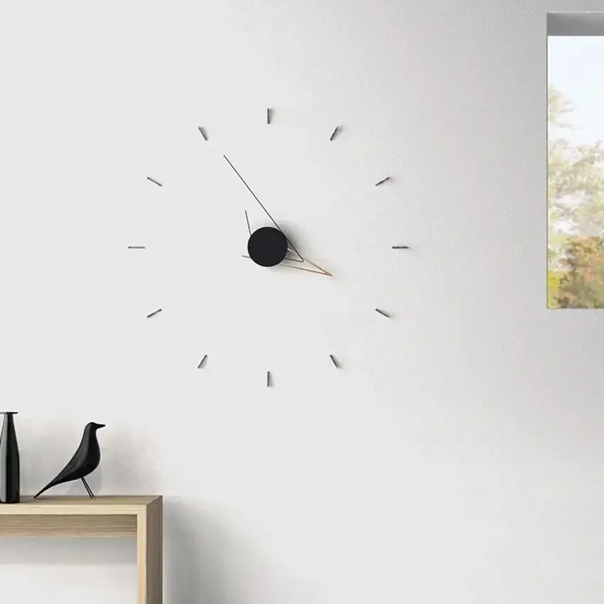 A sleek, white minimalist clock.